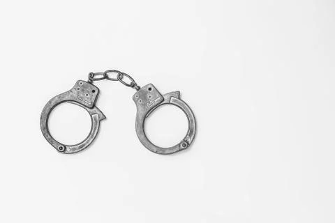 Handcuffs on white background isolate, copy space Stock Photos