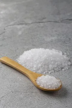 Handful of coarse salt on the table. Stock Photos