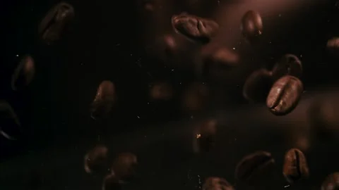 A Handful of Coffee Beans Drop and Bounce Stock Footage 300892555