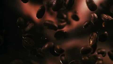 Handful of Coffee Beans Drop and Bounce on Lens Stock Footage 300892567