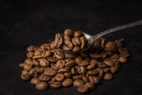 A handful of coffee beans.  Stock Photos