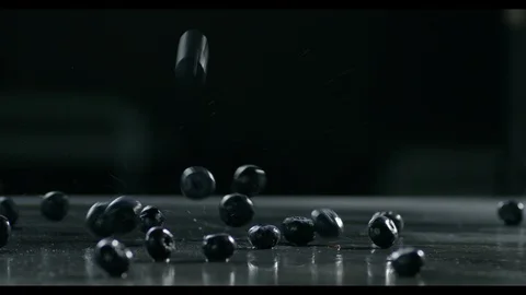 A Handful Of Fresh Blueberries Falling On A Table Surface Shot In Slow Motion Video stock 96163600