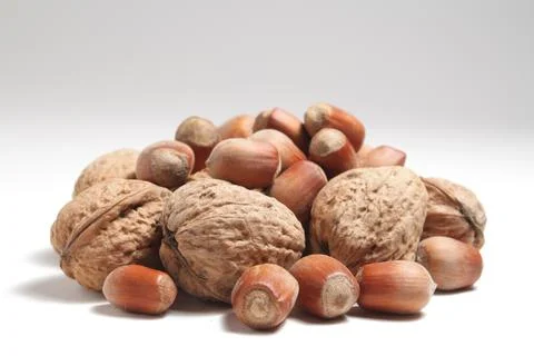 A handful of nuts on a white background Stock Photos