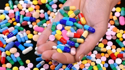 Handful of pills Stock Footage 88466780
