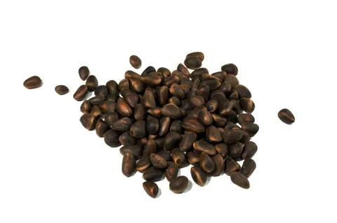 A handful of pine nuts on a white background isolate Stock Photos