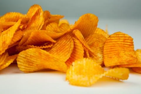 Handful of potato chips Stock Photos