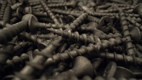 A handful of screws are on the table Stock Footage 146963054