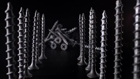 A handful of self-tapping screws are on the table, and the camera moves smoothly Видео 144334651
