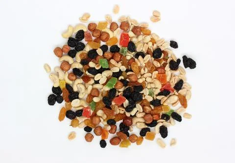 Handful of snacks on a white background. nuts, candied fruits and dried fruit Stock-Fotos