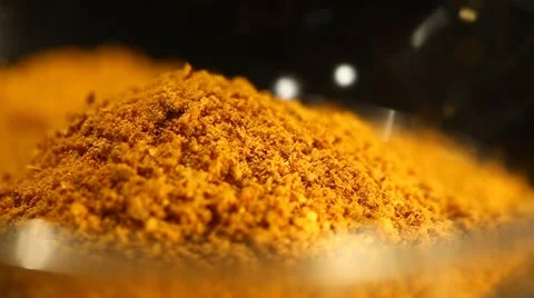 A handful of Turmeric powder Close Up Stock Footage 49500768
