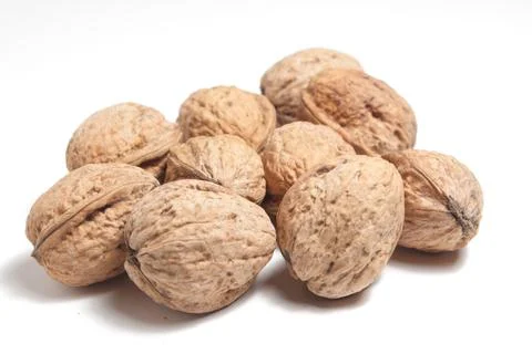 A handful of walnuts on a white background Stock Photos