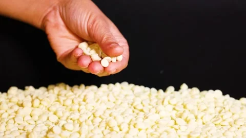 Handful of White Chocolate Chips Stock Footage 313262923