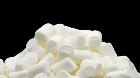 Handful of white marshmallows, spinning in a circle.  Stock Footage 244525946