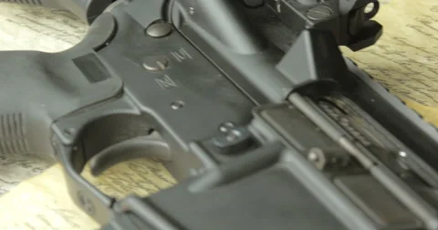 Handgun Assault Rifle and Ammunition on the US Constitution Stock Footage