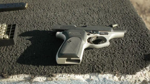 Handgun on bench Stock-Footage 24450882