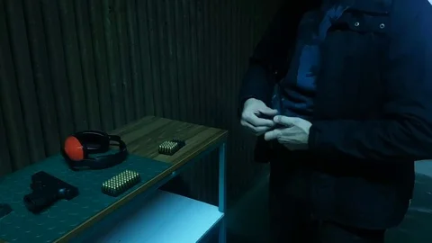 Handgun magazine loading Stock-Footage 82460980