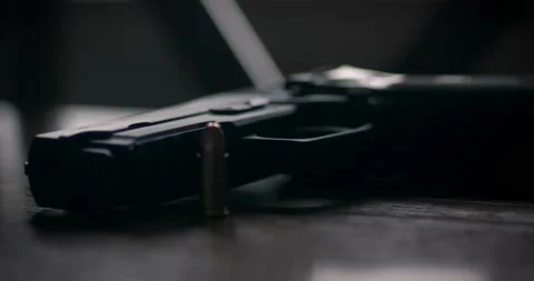 Handgun Picked Up Close Up | Dark &amp; Gritty Stock Footage 229489812