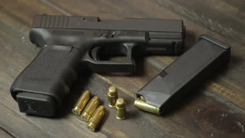 Handgun rack focus Stock Footage 143978063