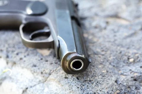 Handgun On Stone Stock Photos