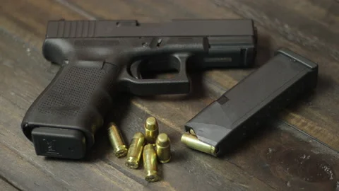 Hand Handgun On Table Stock Video Footage 