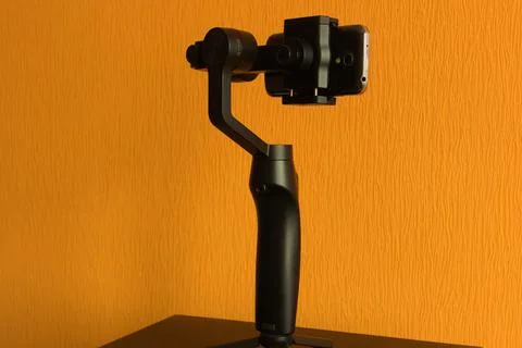 Handheld 3-axis gimbal with a smartphone Stock Photos