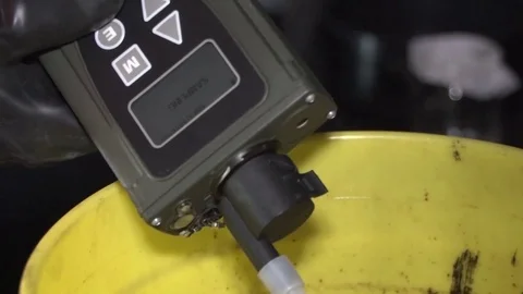 Handheld analyzer being used to scan for contamination Video stock 94698417