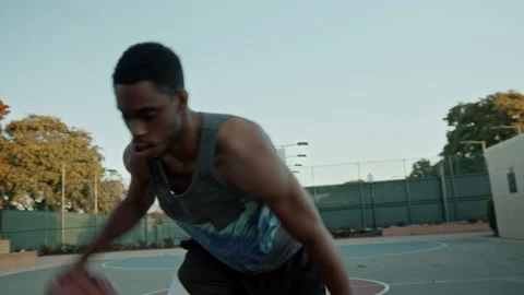 Handheld authentic shot of black man practice ball Stock Footage 170264265