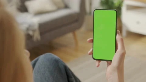 Handheld Camera: Back View of Blond Woman Holding Chroma Key Green Screen Stock Footage 206018561