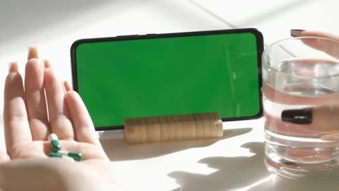 Handheld Camera: Back View of Brunette woman Holding Chroma Key Green Screen Stock Footage 166613522