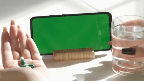 Handheld Camera: Back View of Brunette woman Holding Chroma Key Green Screen Video stock 195389503