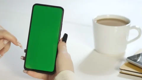 Handheld Camera: Back View of Brunette woman Holding Chroma Key Green Screen Stock Footage 201391506