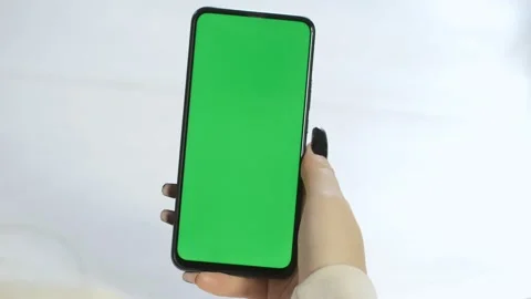 Handheld Camera: Back View of Brunette woman Holding Chroma Key Green Screen Stock Footage 201835912