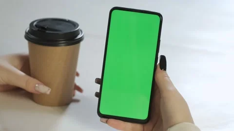 Handheld Camera: Back View of Brunette woman Holding Chroma Key Green Screen Stock Footage 202110148