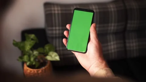 Handheld Camera: Point of View of Man at Modern Room Sitting on a Chair Using Stock Footage 141209809