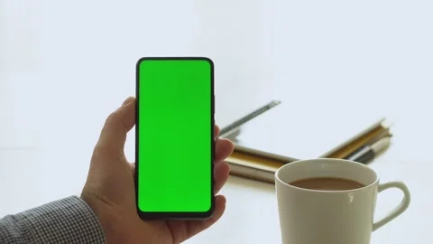 Handheld Camera: Point of View of Man at Room Sitting on a Chair Using Phone Stock Footage 143608512