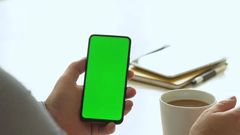 Handheld Camera: Point of View of Man at Room Sitting on a Chair Using Phone Stock Footage 143608628