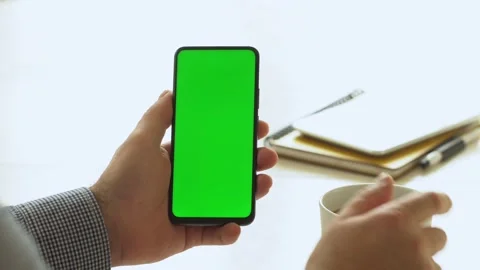 Handheld Camera: Point of View of Man at Room Sitting on a Chair Using Phone Stock Footage 143608865