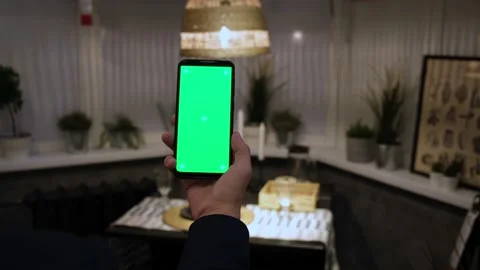 Handheld Camera: Point of View of Man at Modern Room Sitting on a Chair Using Stock Footage 146594737