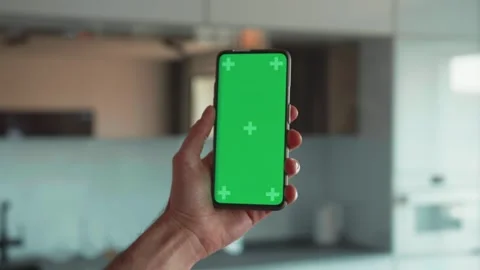 Handheld Camera: Point of View of Man at Modern Room Sitting on a Chair Using Stock Footage 241745210