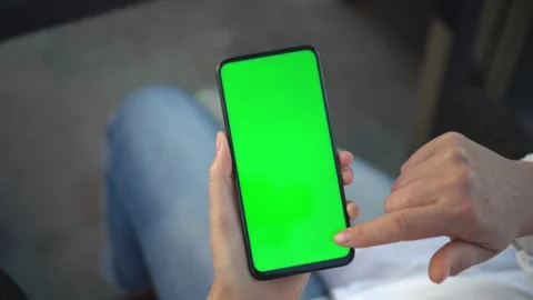 Handheld Camera: Point of View of woan at street Using Phone With Green Mock-up Stock Footage 138132766