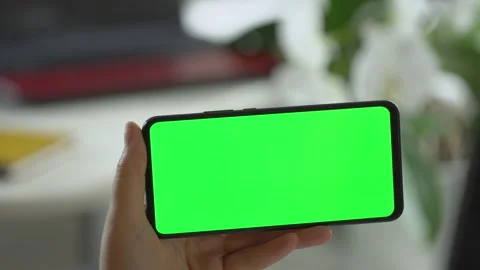 Handheld Camera: Point of View of Woman at Room Sitting on a Chair Using Phone Stock Footage 138373419