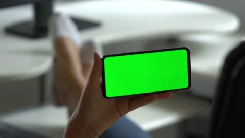 Handheld Camera: Point of View of Woman at Room Sitting on a Chair Using Phone Stock Footage 138374668