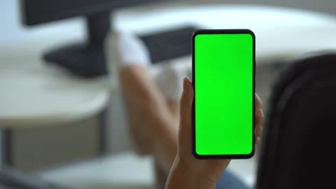 Handheld Camera: Point of View of Woman at Room Sitting on a Chair Using Phone Video stock 138541025