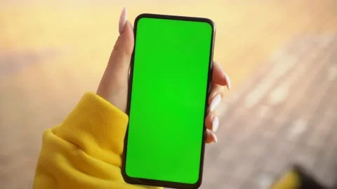 Handheld Camera: Point of View of Woman at street Using Phone With Green Mock-up Stock Footage 141807984