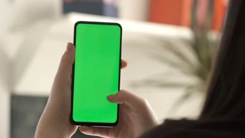 Handheld Camera: Point of View of Woman at Modern Room Sitting on a Chair Using  스톡 동영상 153781067