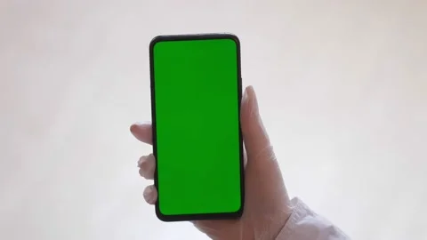 Handheld Camera: Point of View of Woman at Room Sitting on a Chair Using Phone Stock Footage 170035136