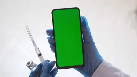 Handheld Camera: Point of View of Woman at Phone with Green Screen for Copy Stock Footage 170349612