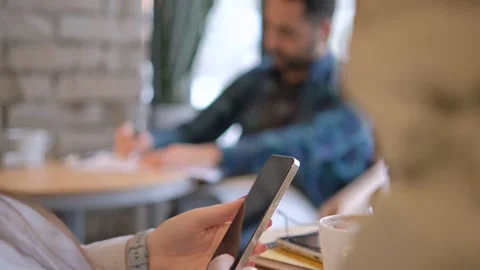 Handheld Camera: Point of View of Woman at Cafe Sitting on a Chair Using Phone Stock Footage 264326466