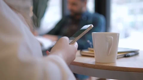 Handheld Camera: Point of View of Woman at Cafe Sitting on a Chair Using Phone Stock Footage 264936175
