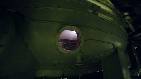 Handheld camera. View through a small window inside a high-tech unit Stock Footage 92494360